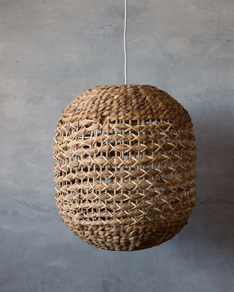 Chunky woven pendant light- perfect for a coastal boho home. Natural rattan with contrasting cream detail in a simple pattern. 